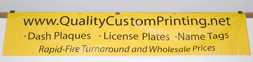 10 foot by 2 foot yellow banner with black lettering